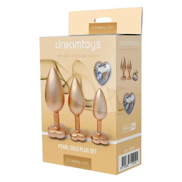Set plug anal DREAMTOYS Pearl Gold Plug. 3 dopuri de dimensiuni progresive. 7.1 cm - 9.5 cm. cu baze în formă de inimă. auriu