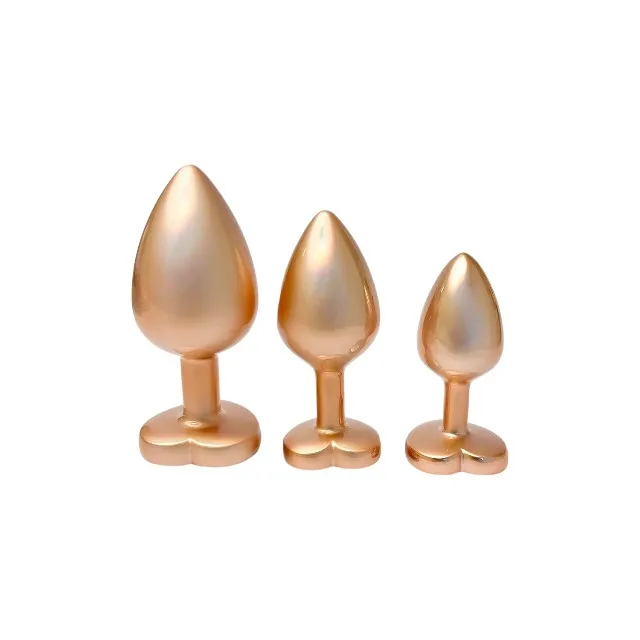 Set plug anal DREAMTOYS Pearl Gold Plug. 3 dopuri de dimensiuni progresive. 7.1 cm - 9.5 cm. cu baze în formă de inimă. auriu
